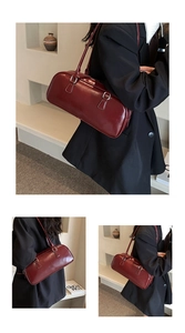 Detail of dark red vintage Boston bag in smooth leather with silver hardware finish