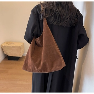 Detailed back view of a brown suede hobo bag with large capacity for women