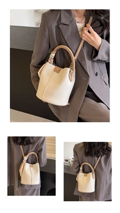 Detailed views of a cream bucket bag with lychee texture and contrasting brown handles