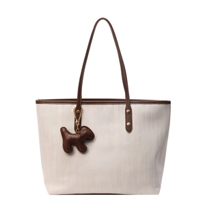 Retro cream tote bag with large capacity and brown dog charm charm for commute