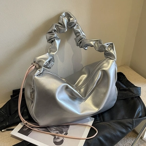 Silver metallic pleated tote bag with pink drawstrings and scrunchie handle for women