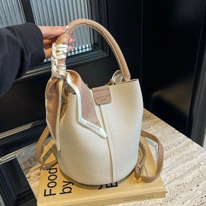 Lychee texture bucket bag in beige and brown contrast with decorative silk scarf