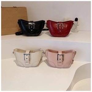 Four crescent shoulder bags in black, red, beige, and pink with large silver metal buckles