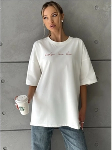 Detail of white oversized cotton t-shirt with red Love love love script print