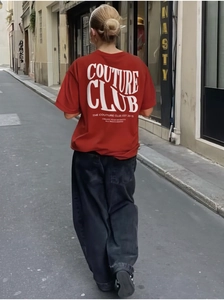 Back view of oversized red t-shirt with Couture Club lettering on high-quality heavy cotton
