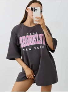 Detail of Brooklyn 1898 print on grey cotton short sleeve oversized t-shirt