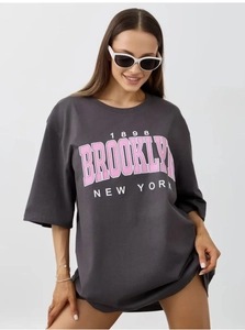 Detail of Brooklyn 1898 print on charcoal grey oversized cotton t-shirt for women