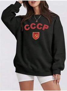 Close-up of CCCP Soviet logo print on black oversized fleece crewneck sweatshirt