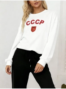 Close-up of the vintage red CCCP print on a white thick round neck sweatshirt