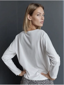 Detail shot of white long sleeve cotton T-shirt showing back fit and premium fabric texture