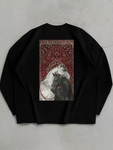 Macro detail of cotton sweatshirt featuring dual horse art print on the back side
