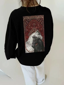 Rear view of oversized black cotton sweatshirt with vintage horse graphic print