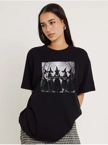 Detail of Girls Will Be Girls typography and retro dark witch illustration on cotton T-shirt