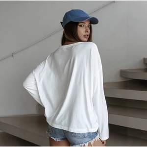 Minimalist oversized white cotton long sleeve T-shirt for men and women in casual style