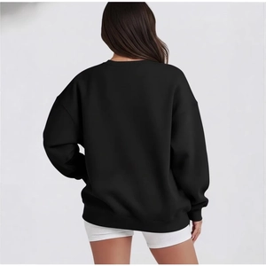 Oversized black crewneck sweatshirt with dropped shoulders and ribbed cuffs, back view