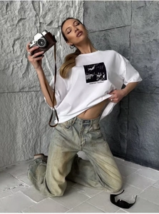 Detail of white cotton T-shirt with vintage portrait print and manifest yourself text
