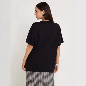 Back view of an oversized black 100% cotton T-shirt with a retro American style fit
