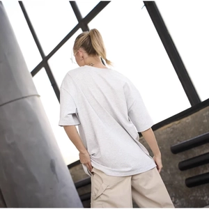 Oversize light gray cotton t-shirt for women in a loose fit urban street style look