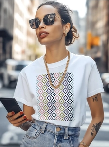 Close-up of colorful pixel geometric diamond print on premium white cotton t-shirt
