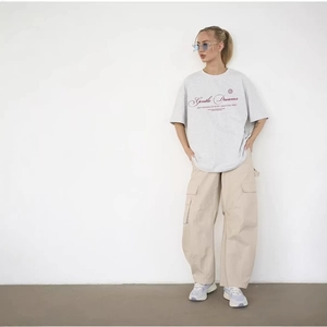 Oversized light grey cotton T-shirt with Gentle Dreams graphic in casual street style