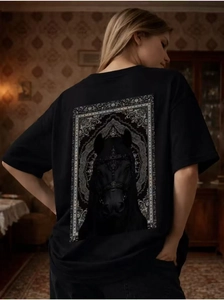 Macro shot of gothic-style horse print detail on heavy cotton black streetwear t-shirt