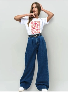 Close-up of white round neck T-shirt featuring artistic pink and red geometric print