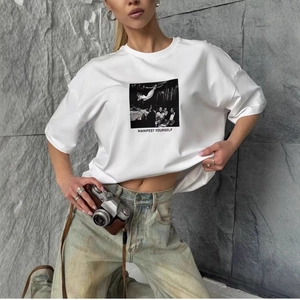Women's white oversized cotton T-shirt with vintage photo print and Manifest slogan