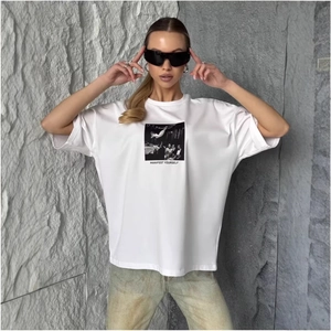 Oversized white cotton T-shirt featuring a black and white graphic print and slogan