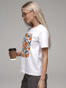 Detailed view of casual white cotton t-shirt featuring artistic orange persimmon print