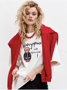 Close-up of heavy cotton white T-shirt featuring Matryoshka doll art and red accessories