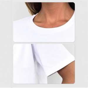 Minimalist white polka dot print cotton T-shirt featuring a classic round neck and short sleeves