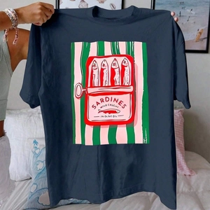 Close-up of sardine can print on dark blue cotton T-shirt with pink and green stripes
