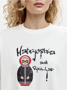 Close-up of pure cotton white T-shirt featuring a creative Matryoshka rock illustration