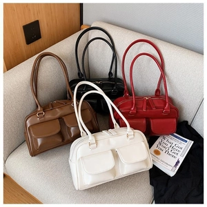 Detail view of multi-pocket retro leather handbags in brown black red and white