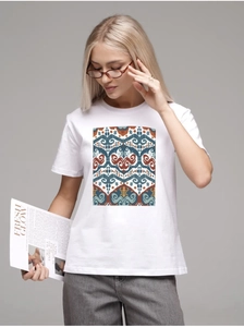 Detail of white cotton T-shirt featuring a colorful ethnic geometric print and crew neck