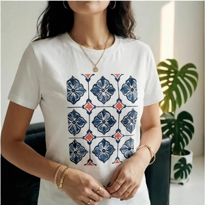 White cotton t-shirt with geometric floral print and stylish gold jewelry accessories