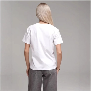 Back view of women's loose white cotton T-shirt with casual dark grey jeans for street style