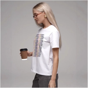 Women's minimalist white cotton T-shirt with pixelated geometric graphic print in soft lighting