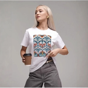 Women's white cotton T-shirt featuring a unique ethnic print and classic round neck design