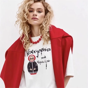 Oversize white cotton T-shirt featuring Matryoshka Rock-Lab graphic and red necklace