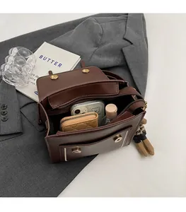 Detailed view of the spacious interior of the brown retro backpack with metal clasps