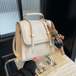 Retro cream white PU leather backpack with gold buckle and cute rabbit charm detail
