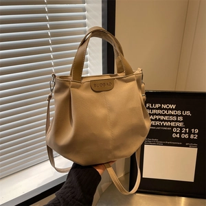 Large beige canvas tote bag with brown leather straps and BUD-BAO logo for daily use