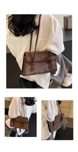Detail view of vintage brown shoulder bag showing faux leather texture and leather charm