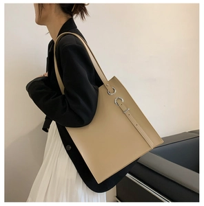 Beige oversized soft PU leather tote bag shown on model for daily commuting style