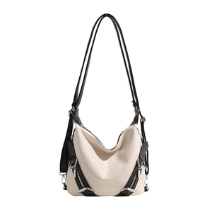Sac à bandoulière beige minimaliste avec anses noires et fermetures éclair argentées