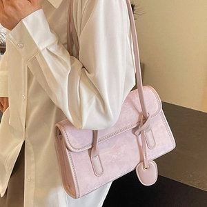 Pink matte leather underarm shoulder bag for women with a cute heart pendant accessory
