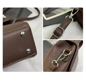 Detailed views of brown leather bag with silver rivets, metal buckle and adjustable strap