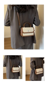 Detail shot of the contrast color quilted square bag with silver metallic twist lock