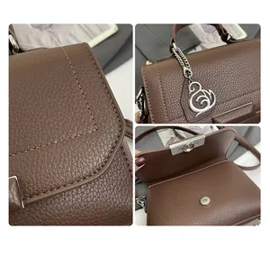 Detailed views of brown pebble leather bag featuring silver swan charm and magnetic closure